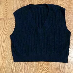 Black cabled v neck vest